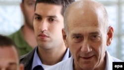 Ehud Olmert (right), seen here in custody in 2009, served as Israel's prime minister from 2006 to 2008.