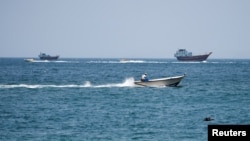 Vessels at the Strait of Hormuz, as seen from Musandam, Oman, on July 26.