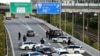 DENMARK -- Police vehicles block the street leading to the Oeresund Bridge near Copenhagen, September 28, 2018