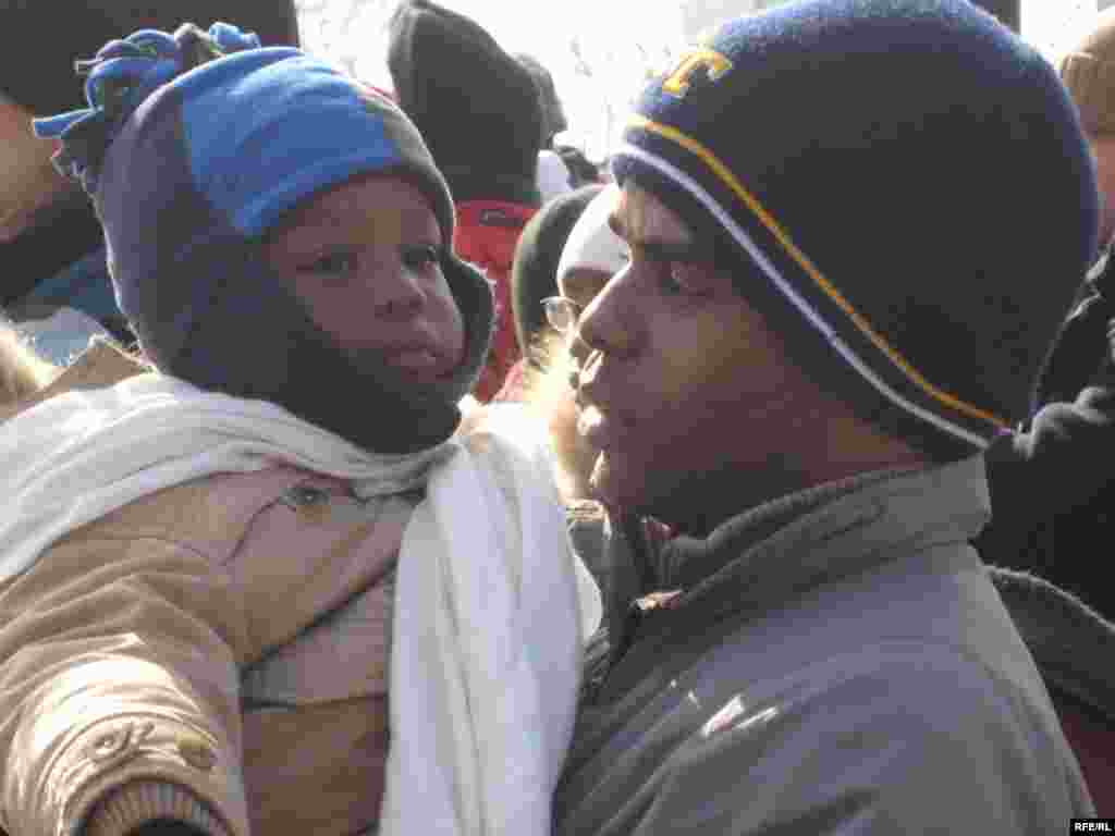 This father and son wait for the inaugural ceremony on the National Mall. - obama20 photo by Ricki Green
