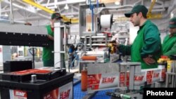 Armenia -- Workers at a recently opened car battery plant in Yerevan partly owned by a German company, 23Nov2010.