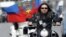 Night Wolves leader Aleksandr Zaldostanov (front-right), aka 'the Surgeon' and fellow bikers take part in a rally earlier this year. 