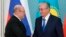 Russian Prime Minister Mikhail Mishustin (left) and Kazakh President Qasym-Zhomart Toqaev (file photo)