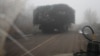 A Ukrainian armored vehicle fitted with metal wire armor on a road near Pokrovsk on November 23