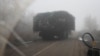 A Ukrainian armored vehicle fitted with metal wire armor on a road near Pokrovsk on November 23