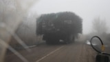 A Ukrainian armored vehicle fitted with metal wire armor on a road near Pokrovsk on November 23