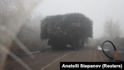 A Ukrainian armored vehicle fitted with metal wire armor on a road near Pokrovsk on November 23
