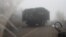A Ukrainian armored vehicle fitted with metal wire armor on a road near Pokrovsk on November 23