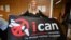 International Campaign to Abolish Nuclear Weapons executive director Beatrice Fihn holds a banner with its logo after ICAN won the Nobel Peace Prize on October 6.