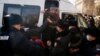 Police detain opposition supporters in Almaty during Kazakhstan's parliamentary elections on January 10.