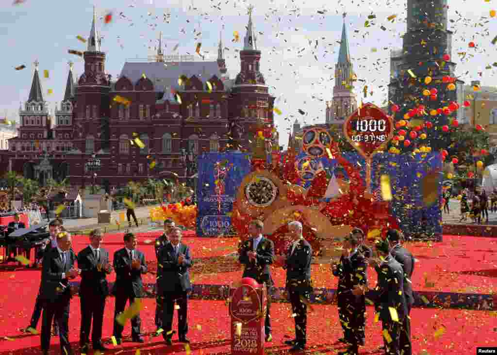 Former and current soccer players with officials take part in a ceremony to launch the clock, counting down 1000 days to the start of the 2018 FIFA World Cup in Manezhnaya Square in central Moscow on September 18. (Reuters/Maksim Shemetov&nbsp;)