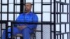 War Crimes Prosecutor Calls For 'Immediate' Arrest Of Qaddafi's Son Saif