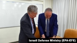 ISRAEL -- Israeli Defense Minister AVigdor Lieberman (R) shows a map to US. national security adviser John Bolton in Jerusalem, August 20, 2018