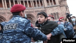 Armenia - Riot police detain an opposition protester outside the main government building in Yerevan, November 11, 2021.
