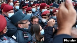 Armenia - Riot police clash with opposition protesters outside the main government building in Yerevan, November 11, 2021.