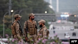 Pakistani soldiers stand guard on a street leading to the Red Zone area after tightened security measures ahead of the expected US–Iran peace talks in Islamabad. President Donald Trump on April 25 called off the planned trip of the lead US negotiators.
