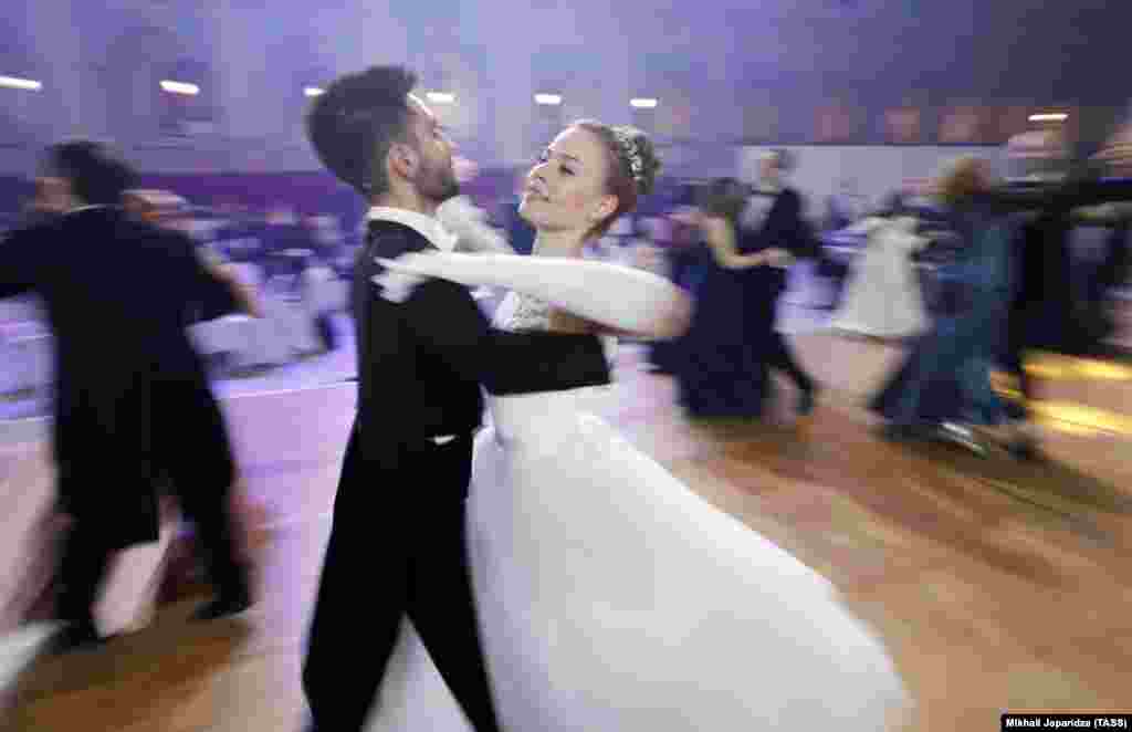 A young pair twirl through a dance during the 18th annual Viennese Ball in Moscow.