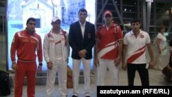 Armenia -- Armenian Olympic athletes pictured at Yerevan airport before leaving for London, 25Jul2012.