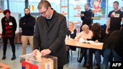 Serbian President Aleksandar Vucic casts his ballot at a polling station in Belgrade on December 17.