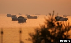 Vessels in the Strait of Hormuz as seen from Musandam, Oman, on June 16.