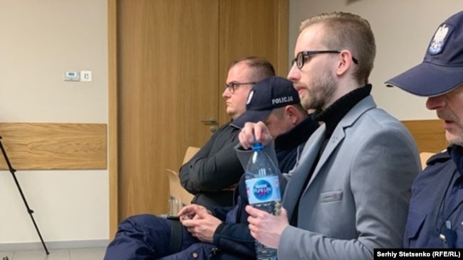 Michal Prokopowiczsitting (wearing glasses) in a courtroom in Krakow, Poland on January 14, 2019.