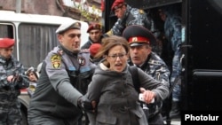 Armenia - Riot police detain a protester in Yerevan, 02Dec2013.