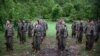 Kurdistan Workers' Party (PKK) members stand at attention after arriving in the northern Iraqi city of Dohuk on May 14.