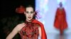 A model wears a creation by Russian fashion designer Slava Zaitsev during the Fashion Week in Moscow on March 29, 2013.