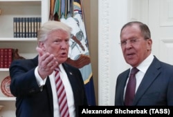 U.S. President Donald Trump greets Russian Foreign Minister Lavrov at the White House last month.