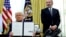 US President Donald Trump holds an executive order about tariffs increase while flanked by Commerce Secretary Howard Lutnick in Washington.