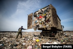 A truck dumps garbage at the Yadrovo solid-waste landfill in the village of Yadrovo. On March 21, 2018, dozens of children were hospitalized with suspected poisoning from gases leaking from the landfill.