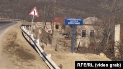 A new sign erected by Azerbaijani troops marks Azerbaijan's border with Armenia in the village of Shurnukh.