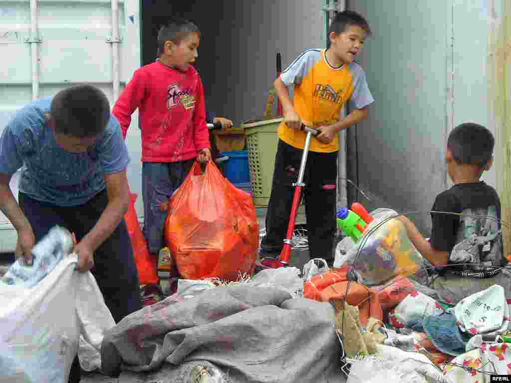 Many children are employed at Almaty's central market to sort and carry goods (RFE/RL) - "For child laborers, the psychological scars of what they have endured can stay with them for the rest of their lives," a UN report reads. "Many suffer from anxiety or depression...and can develop low self-esteem and a sense of helplessness."