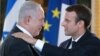 Presidenti francez, Emmanuel Macron (djathtas) dhe kryeministri izraelit, Benjamin Netanyahu.