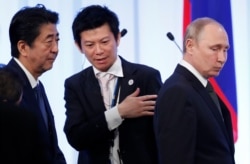 Прем'єр Японії Сіндзо Абе (ліворуч) та президент Росії Володимир Путін. Осака, 29 червня 2019 року
