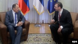 Serbian Prime Minister Aleksandar Vucic (right) meets with Russian Foreign Minister Sergei Lavrov in Belgrade on December 12.