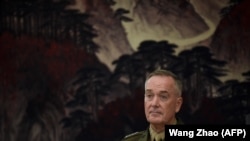 The chairman of the U.S. Joint Chiefs of Staff, General Joseph Dunford, listens as he meets with the Chinese deputy chairman of the Central Military Commission in Beijing on August 17.