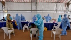 Пункт тестирования на COVID-19 в Ахмедабаде, Индия. 17 июля 2020 года.