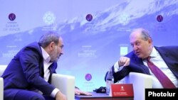 Armenia -- President Armen Sarkissian (R) and Prime Minister Nikol Pashinian attend a conference in Dilijan, June 8, 2019.