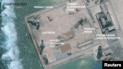 Спутниковый снимок строителсьтва китайских военных объектов на одном из островов архипелага Спратли. Март 2016 года