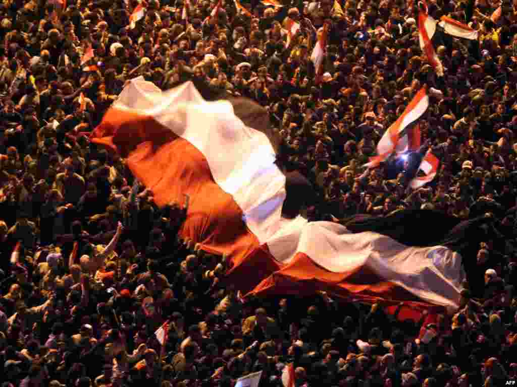 Protesters celebrate in Tahrir Square after the announcement by Vice President Omar Suleiman that Mubarak had stepped down on February 11, 2011.