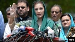 FILE: Maryam Nawaz (C), daughter of former Prime Minister Nawaz Sharif, talks to journalists after appearing before an investigation team in Islamabad on July 5.