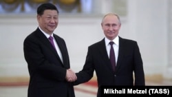 Президент России Владимир Путин и генсек ЦК Коммунистической партии Китая Си Цзиньпин