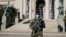 A Serbian soldier patrols in front of the parliament building in Belgrade as the number of coronavirus cases grow around the world on March 16.
