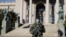 SERBIA -- A Serbian army soldier patrols in front of the parliament building as the number of coronavirus disease (COVID-19) cases grow around the world, in Belgrade, March 16, 2020