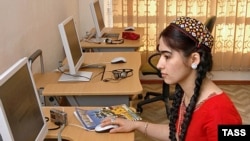 A woman at an Internet cafe in Ashgabat uses the world's slowest connection.