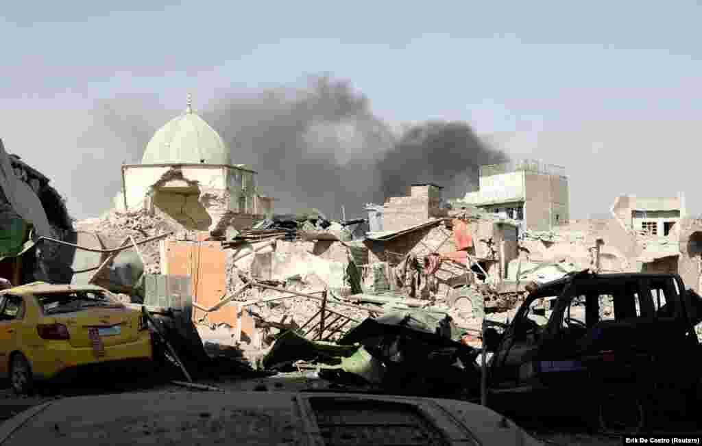 Smoke billows from the ruined Grand Al-Nuri Mosque after it was retaken by Iraqi forces in the Old City in Mosul on June 29. (Reuters/Erik De Castro )