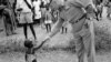 A UN commander in the Congo greets a youngster during his tour of an outpost in 1960. The UN mission there continued until 1964, during which time it evolved from being<span style="font-family: sans-serif; line-height: 19.1875px; background-color: rgb(255, 255, 255);">&nbsp;a peacekeeping presence into a military force</span>.