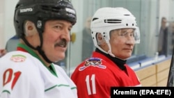 Russian President Vladimir Putin (right) and Belarusian President Alyaksandr Lukashenka take a rest during a match of the Night Hockey League teams in Rosa Khutor in the Black Sea resort of Sochi on February 7.