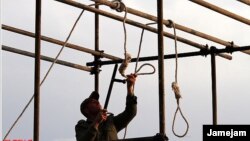 A soldier prepares a noose for a public execution. The recent hanging of 16 Baluch "bandits" is contributing to a cycle of violence.
